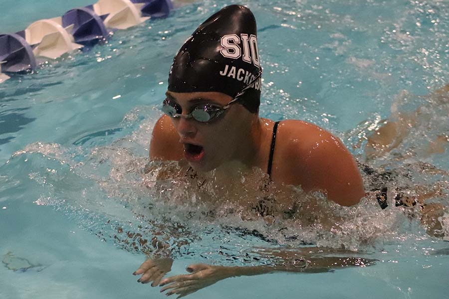 Senior Reilly Jackoboice gasps for air on the 100 yard breaststroke Jan. 11 at the Gladstone Aquatic Center.