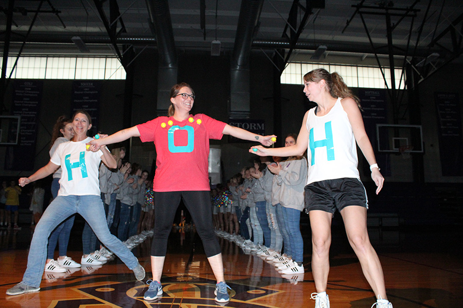 Science teachers Amy Vandenbrul and Kaci Flippo along with former science teacher Erin Paterson compete in last year's Storm Stomp three-on-three basketball tournament. This year, Storm Stomp will be a 5k race held on April 18. 