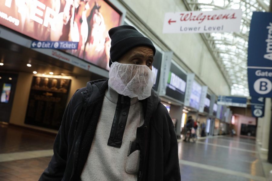 A passenger wears a face mask at a mostly empty Union Station railway station in Washington, D.C., due to the COVID-19 pandemic on Friday, March 20, 2020. (Photo by MCT Campus)