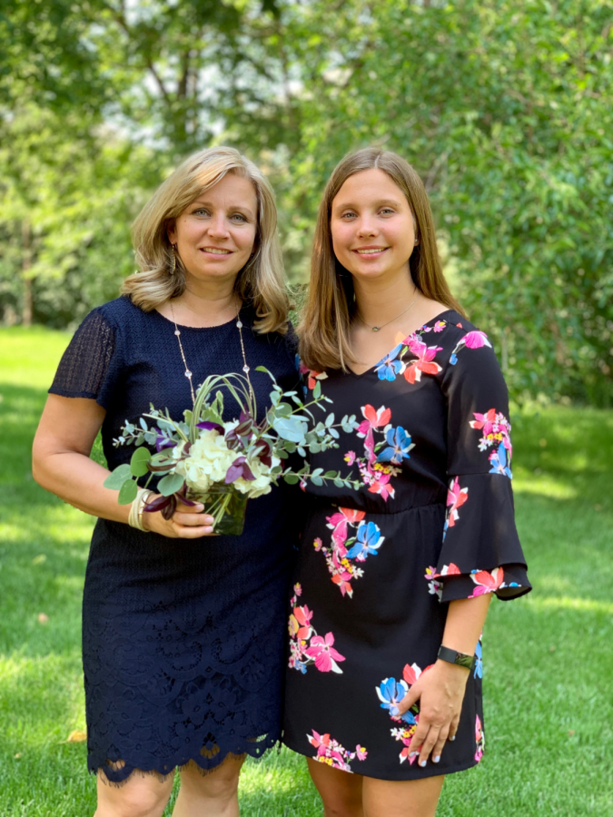 15-year-old Baklanov poses outside with her mother for a photo. 