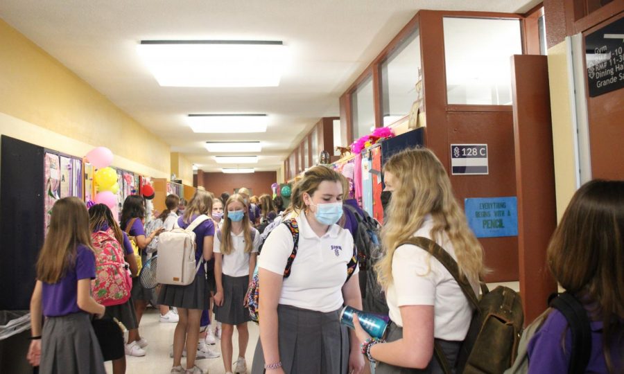 The freshman hallway was teeming with students going from class to class. Noting what she likes about being a freshman as Sion, freshman Gretchen Kowalewich said, I like it here. Everyone is really talkative and nice.