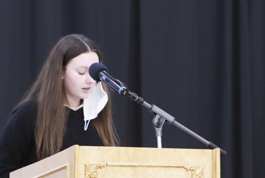 Sophomore Sarah Lillis reads a prayer during Mass.