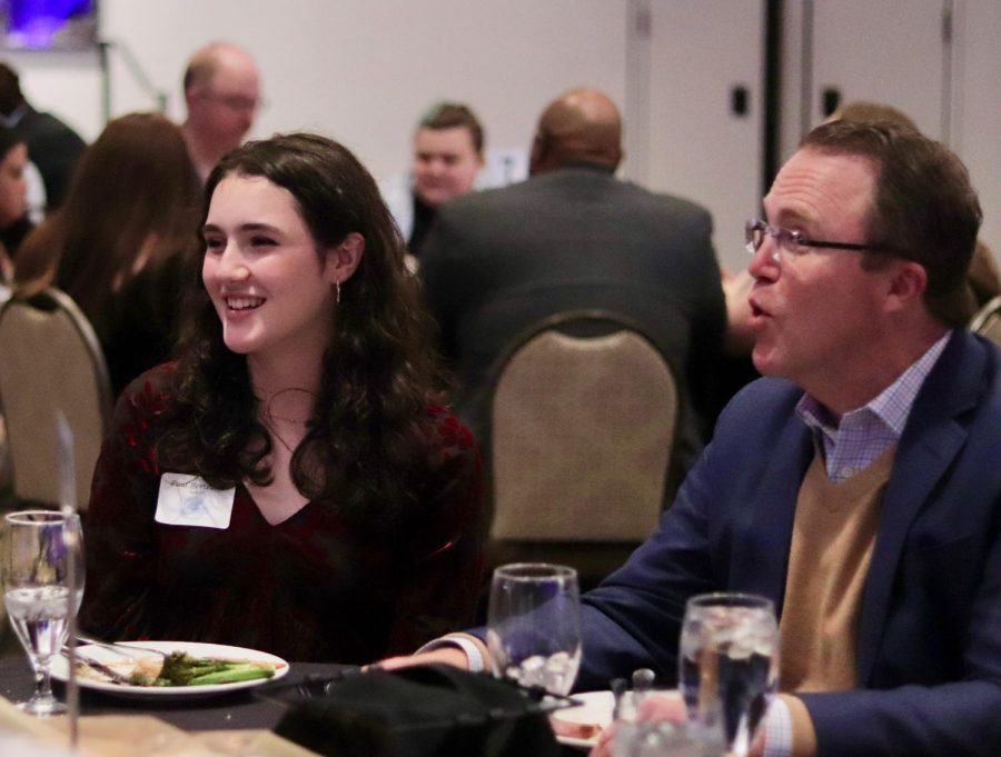 Sophomore Noelle Bertrand eats dinner with her dad. 