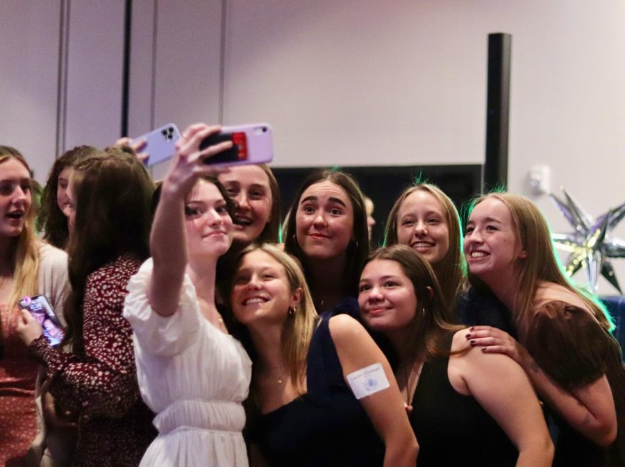 Seniors take a selfie on the dance floor. 