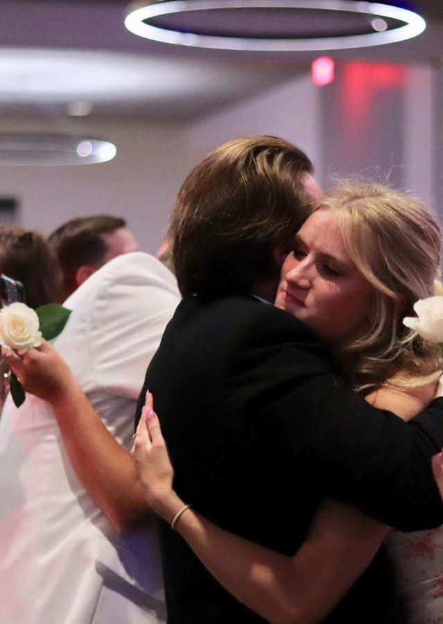 Senior Grace Townsend hugs her dad after the song. 