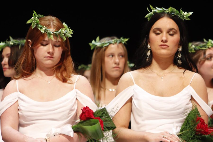 Maggie Carpenter '22 and Sophia Totta '22 listen to the closing prayer.