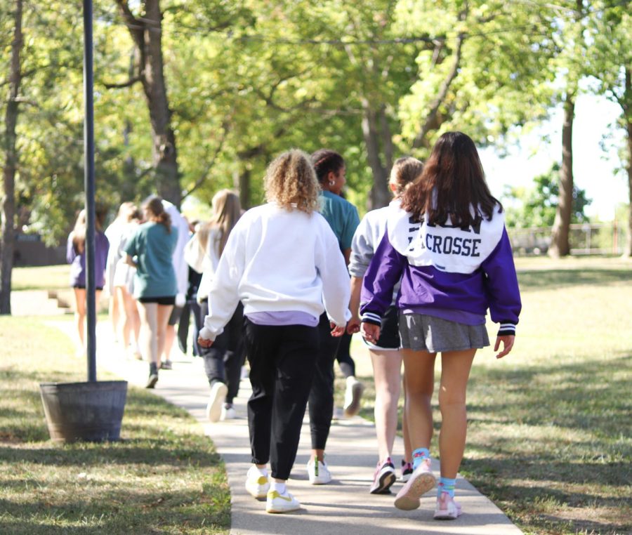 Senior students bond while walking on a trail together at Three Trails Camp and Retreat Center. 