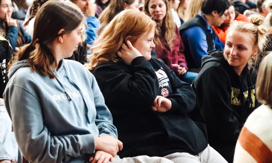 Senior Sofia Boulware and Juniors Tillie DeVolder and Ellie Henson join in on the prayer service's open discussion about the main themes of the speakers stories. 