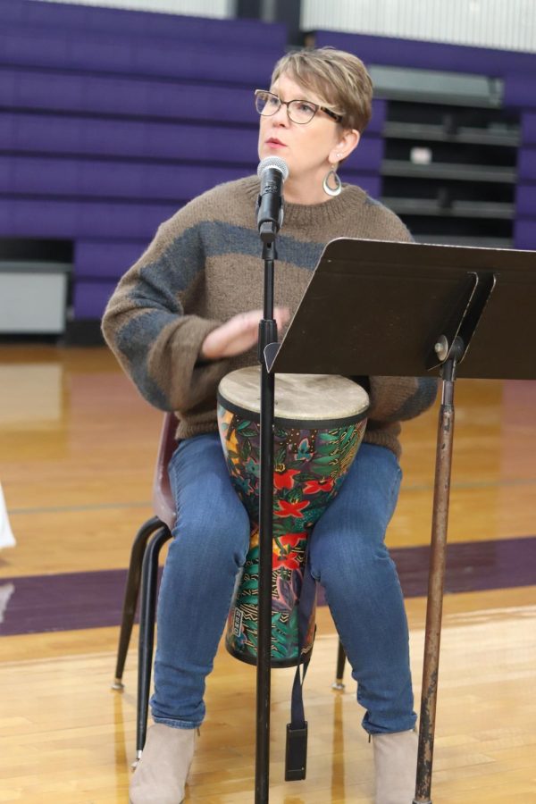 Music director Elizabeth Mulkey drums along as she shares a duet with athletics director Kate Pilgreen