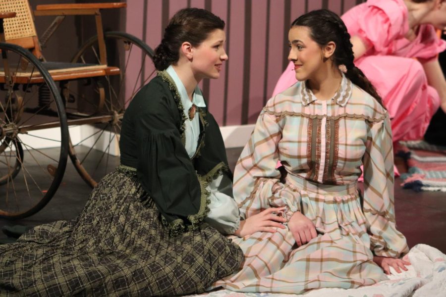 Sitting upon a towel at the beach, Marmee and Beth, played by junior Suzanne Sade and senior Carolina O'Byrne, respectively, look for hope and potential for Beth's recovery.