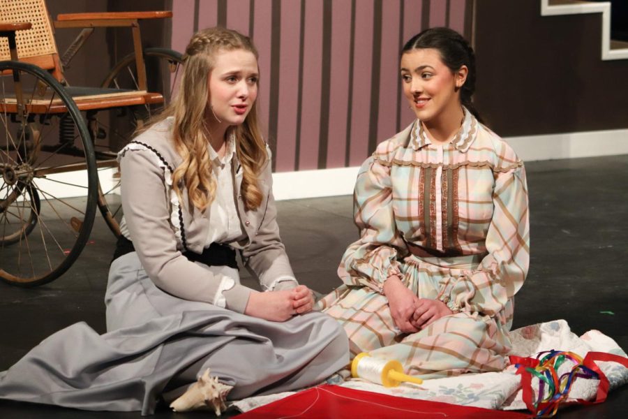 Sitting on the beach, Jo and Beth March, played by seniors Addie Hiestand and Carolina O'Byrne, respectively, reminisce on their childhood memories. 