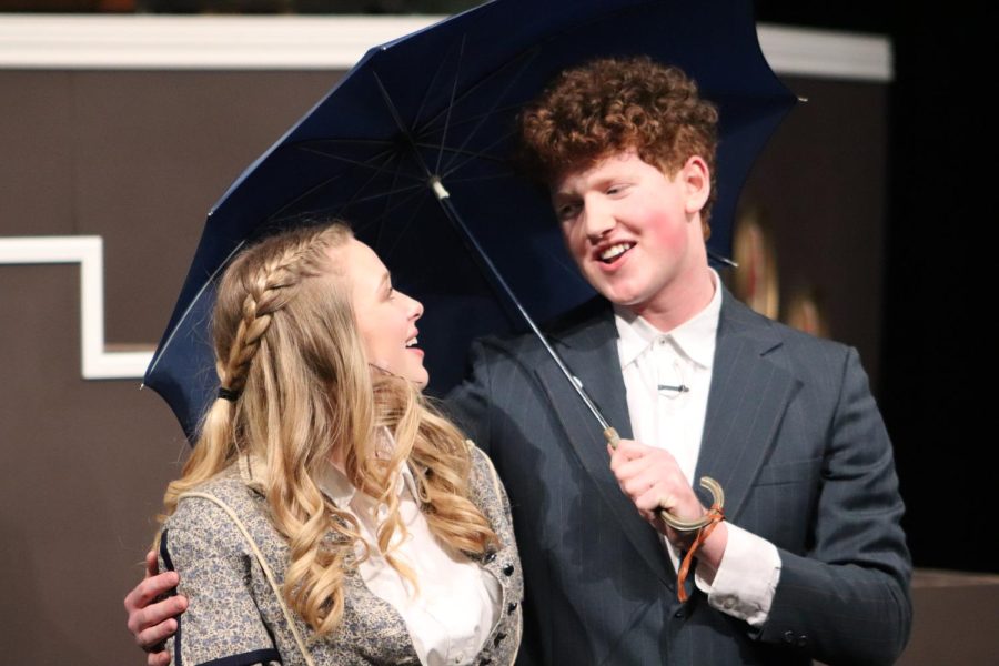 Staring lovingly at one another, senior Addie Hiestand and Rockhurst senior Matthew Schneeberger enact the proposal scene between Jo and Professor Bhaer, performing "A Small Umbrella."
