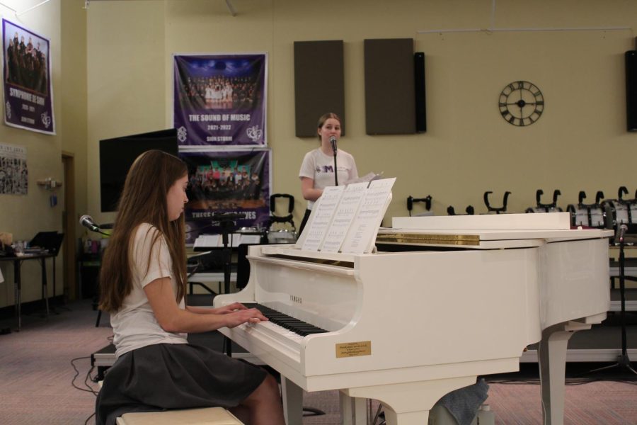 Senior Lauren Millard sings while Junior Ginger Griffiths accompanies, and freshman Merideth Daly plays drums to perform "Can't Help Falling in Love" by Elvis Presley.   