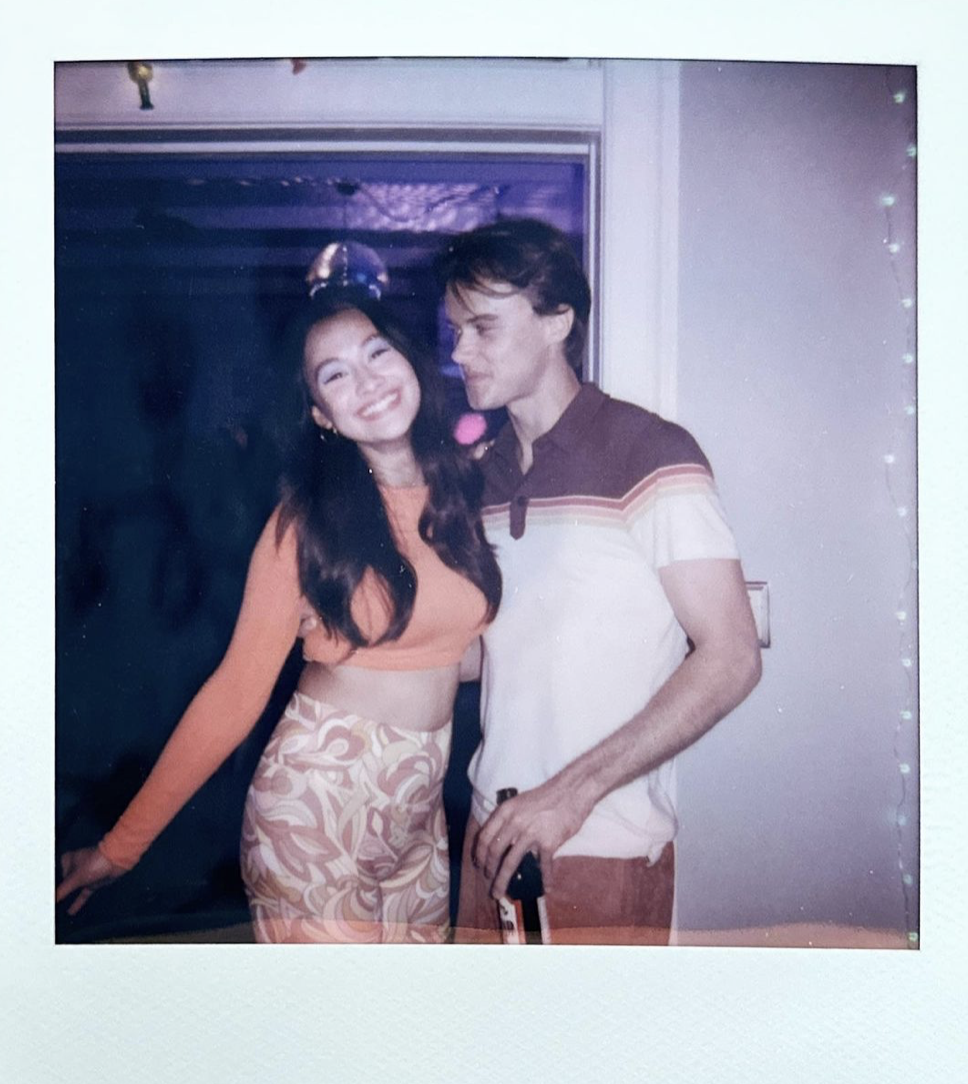 Chris Briney and Lola Tung pose together for a polaroid during the filming of Season 2 Episode 6. Via The Summer I Turned Pretty Instagram