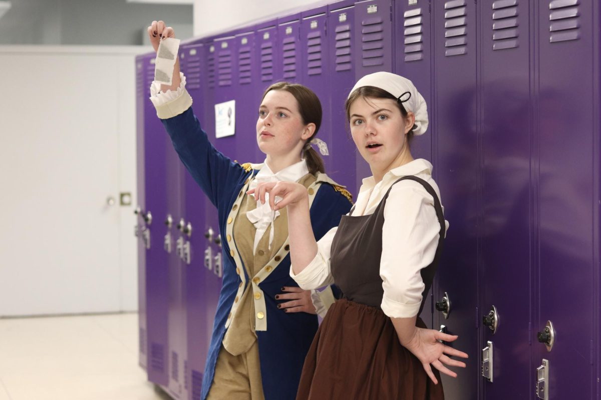 Tea Party:
Holding teabags, senior Elwyn Patterson (right) and junior Heidi Nance (left) pose for a photo.
