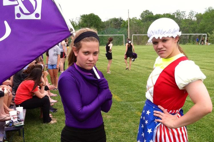 Seniors Kim Fryer and Kristine Sullivan ramp up the crowd during the state soccer quarterfinals.  Sion lost to the Kearney Bulldogs 0-4.