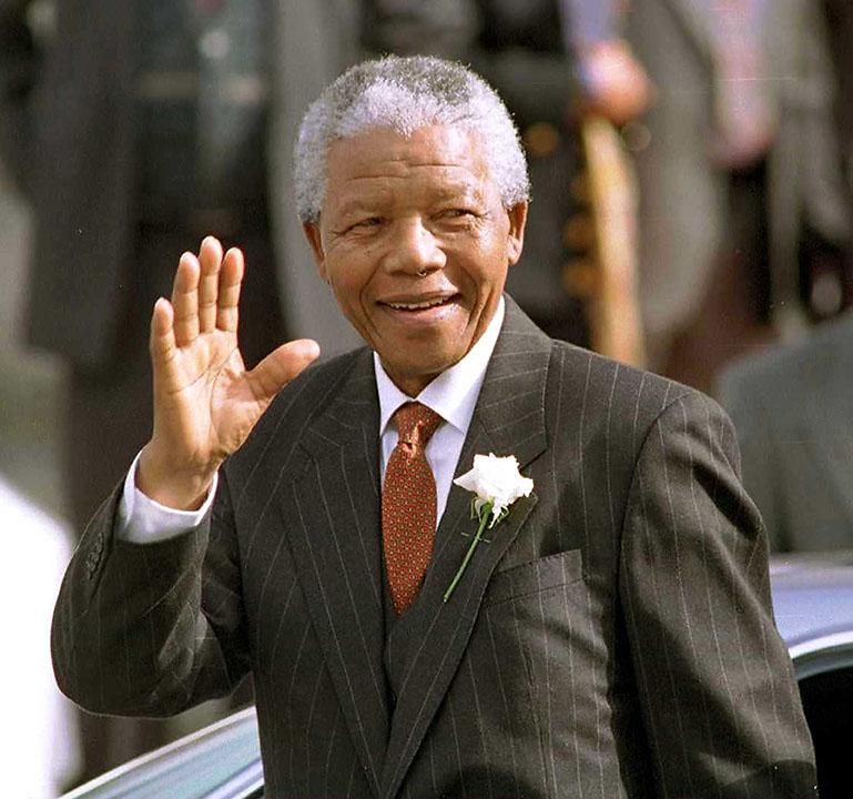 South African President Nelson Mandela makes his way to Parliament in Cape Town, South Africa, in this May 9, 1994, file photo.