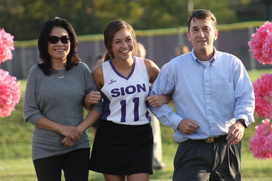 Varsity Captain Zoey Sweeny is honored during senior night, before the game against St. Thomas Aquinas.