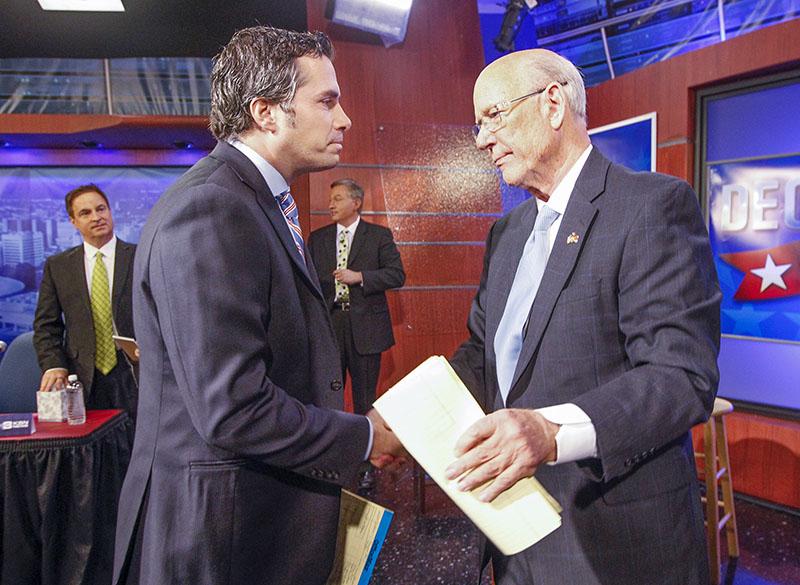 Senate candidate Greg Orman and incumbent Senator Pat Roberts shake after their televised debate. Roberts won the election.