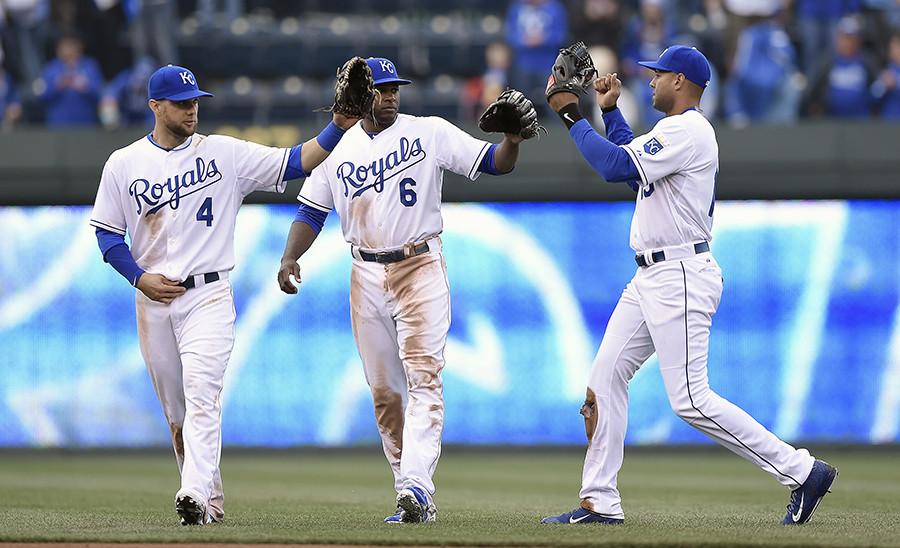 Kansas City Royals left fielder Alex Gordon (4), center fielder Lorenzo Cain (6) and right fielder Alex Rios (15) celebrate the team's 10-1 win over the Chicago White Sox on Monday, April 6, 2015, at Kauffman Stadium inKansas City, Mo.