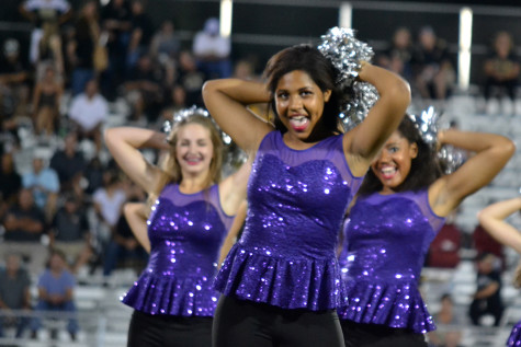 Senior Daria Kinchelow performs during dance team's routine at Rockburst High School Sept. 4. 