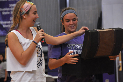 Senior Storm Stomp Co-Chairs Katie Pendergast and Stephanie Ostrander pulled freshman Ingrid Keane's name during the raffle for a pair of Lululemon leggings. 