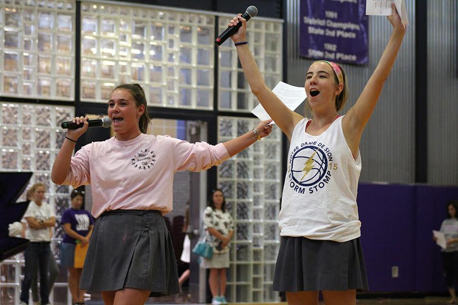 Senior Scream Team Leaders Mary Beth Ferber and Katie Pendergast celebrate after senior Anna Ciani won one of the sock toss games. The games were to kick off the annual Sock it to Poverty, which runs from Sept. 8 to Sept. 17. 