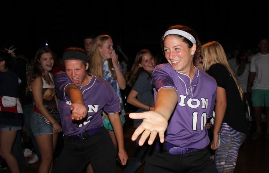 Sophomores Mariah Lynn and Sarah Totta came late to Fall Dance after an all-day softball tournament. 