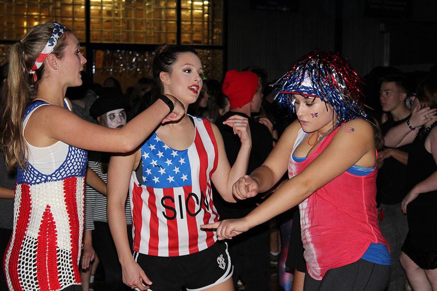 Seniors Olivia Dugan, Tatum Gibbar and Alexis Cucchiara get down during Fall Dance.