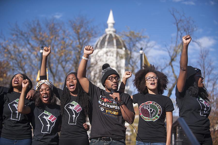 Concerned Students 1950 and the student body chant for solidarity and power at Traditions Plaza during a press conference following the Concerned Students 1950 protest on Monday, Nov. 9 2015, in Columbia, Mo. 