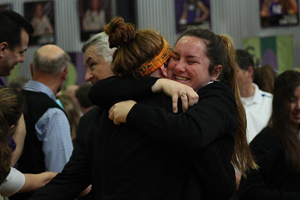 Senior Molly McEnerney and sophomore sister Aidan McEnerney hug