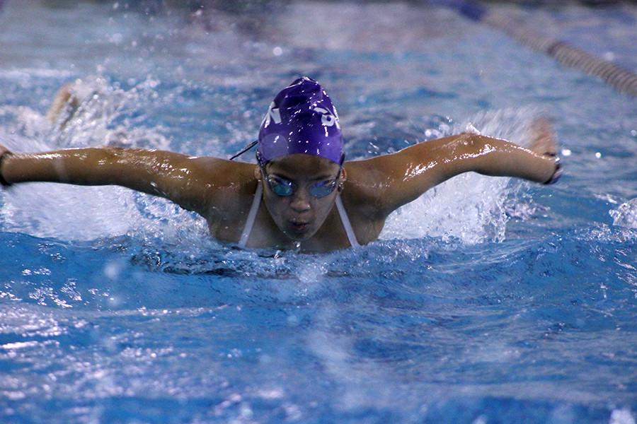 Sophomore Ann Huff prepares for the meet at Lee's Summit High School that took place Dec. 5. The swim team practices at the YMCA.