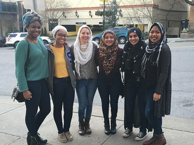 Senior Manahil Khan (second from right) poses with her friends after going to lunch to raise awareness for the hijab. 