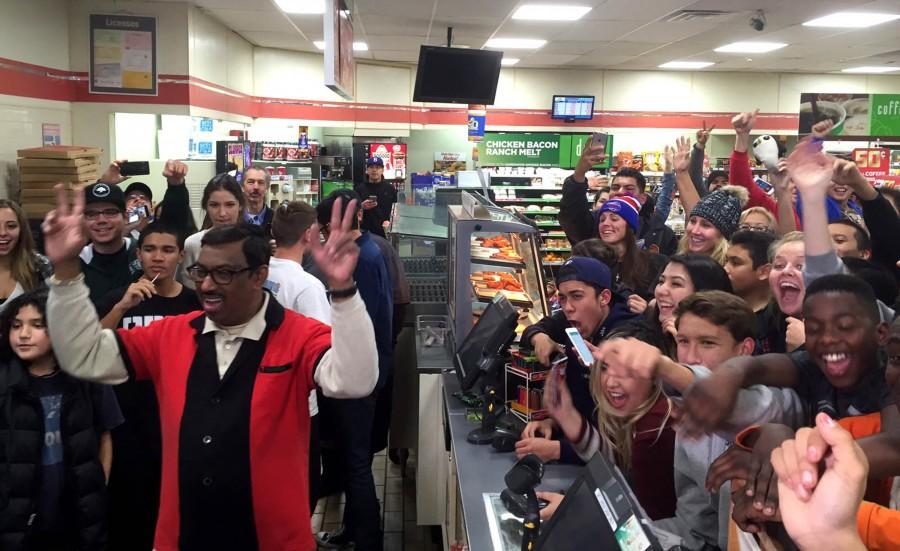 M. Faroqui, left, who sold the Powerball winning ticket at a 7-11 in Chino Hills, Calif., reacts with the crowd in the store on Wednesday, Jan. 13, 2016. (Michael Robinson Chavez/Los Angeles Times/TNS)