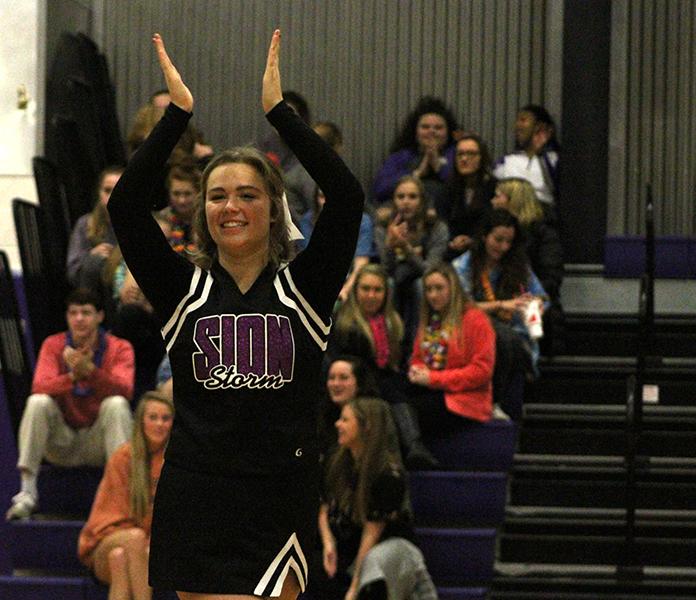 Senior Emmie Gragg cheers during halftime.