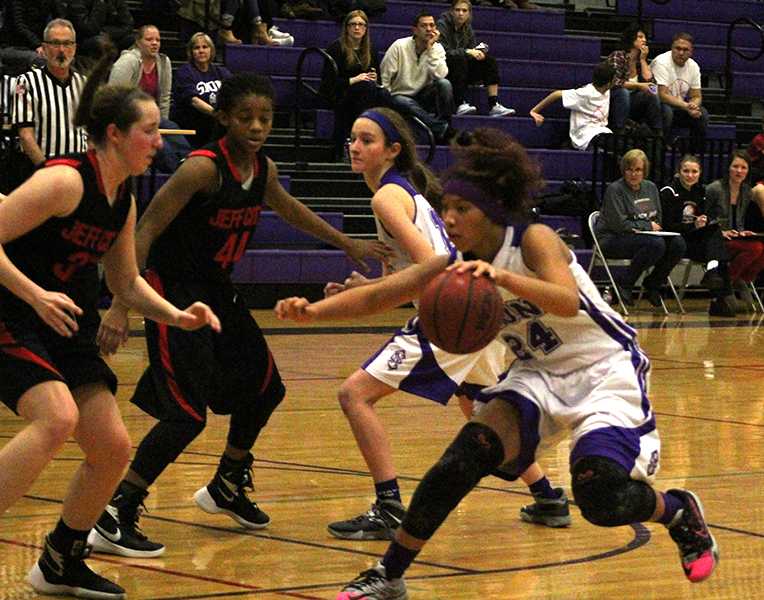 Sophomore Amaya Adams drives to the basket against Jeff City's defense.