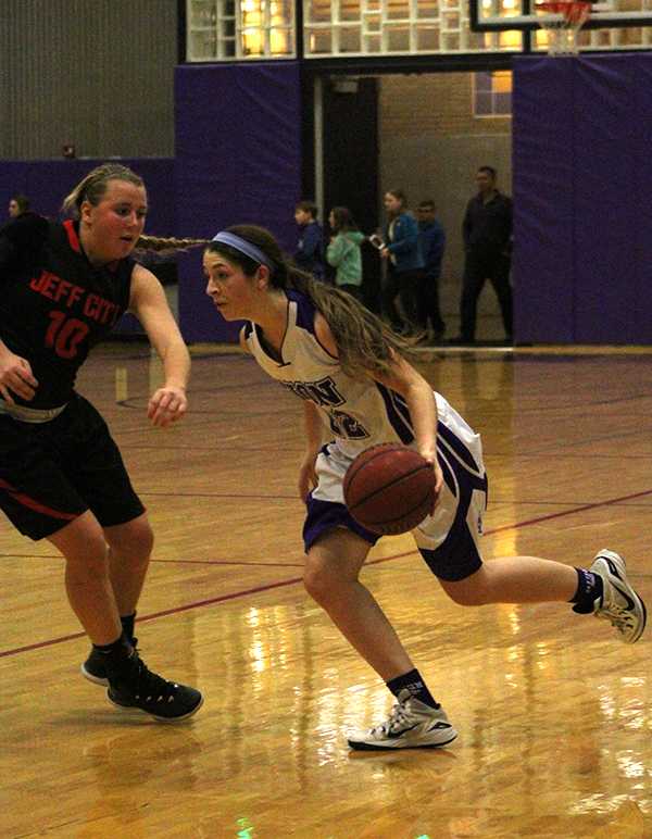 Sophomore Sarah Totta makes a move toward the basket agains Jeff City defender Taylor LePage.