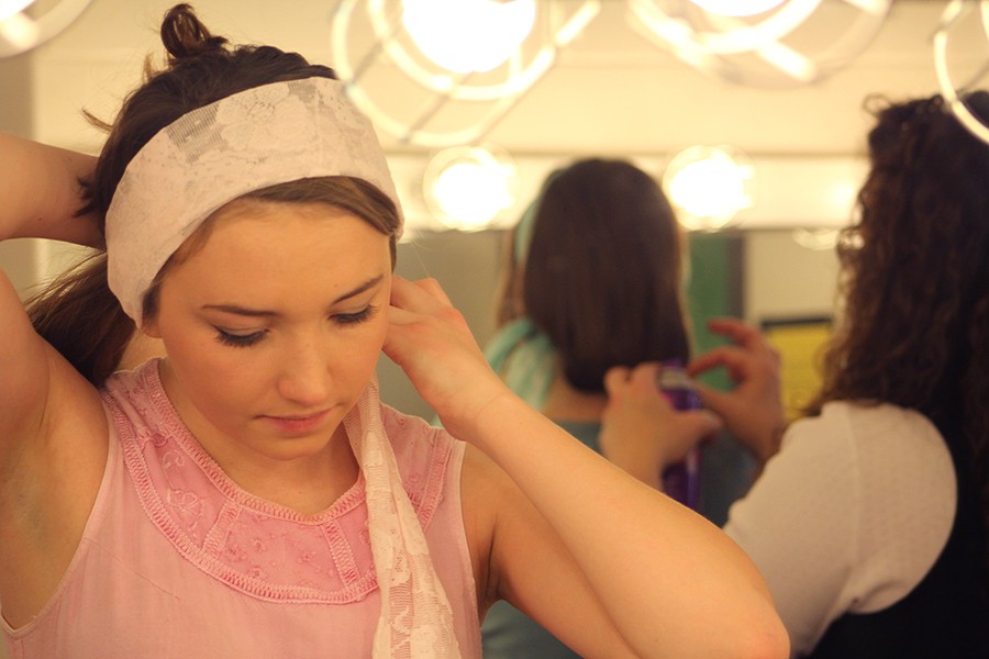 Junior Maddi McMaster does her hair in the dressing room before the Jan. 21 dress rehearsal of "Thoroughly Modern Millie." This was her third  production at Sion. 