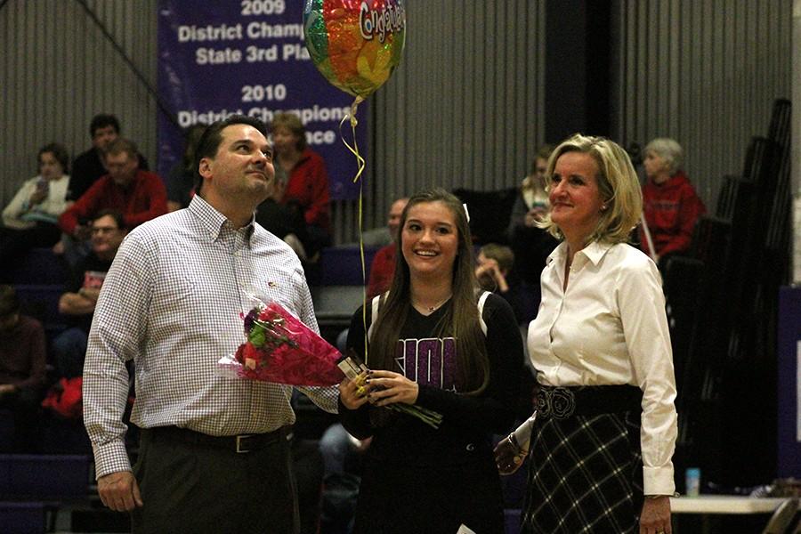 Senior Addison Crawford is honored during senior night with her parents. 