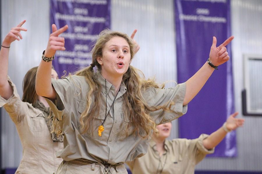 During last year's STUCO dance, junior Katia Hauptmann points while singing along to the music during the junior class dance.
