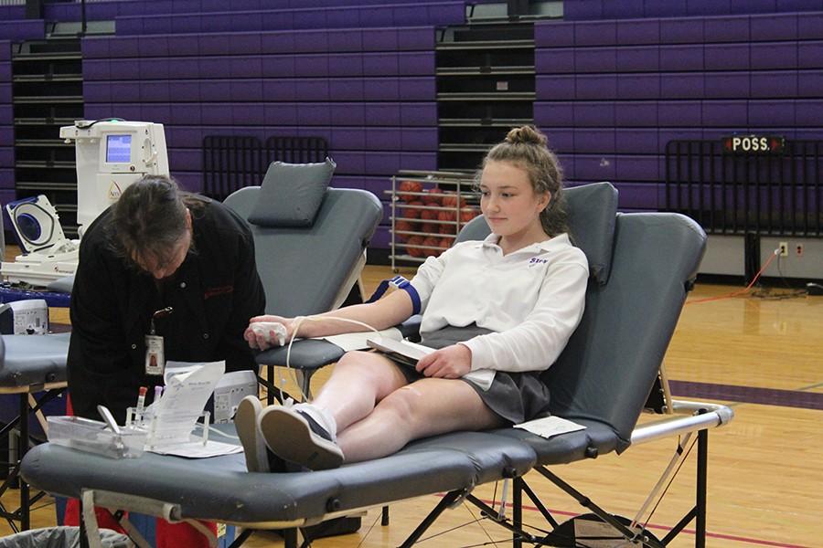 Junior Maddi McMaster participates in the blood drive put on by National Honor Society.