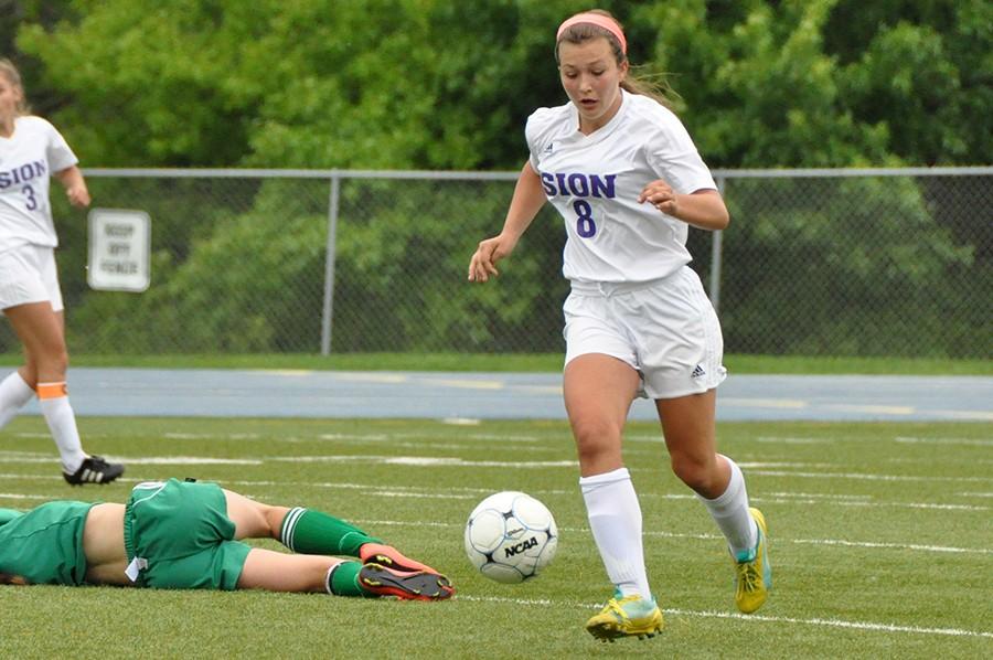 Zoe Trouvé races past Smithville’s offense as she dribbles towards midfield in last season's quarterfinal game. 