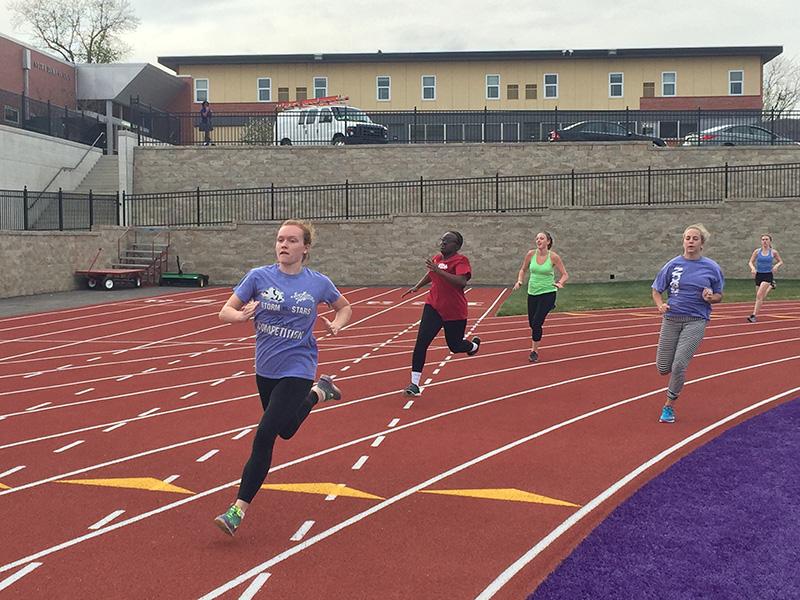 Junior Nora Malone, sophomores Lauren Wyatt and Aubrey Johnston and junior Abby McLiney run during a sprint time trial.