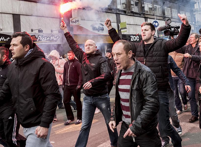 Self-proclaimed &quot;hooligans&quot; protest at a memorial site for the victims of March 22&apos;s terrorist attacks in Brussels on Sunday, March 27, 2016. (Polet/Reporters/Zuma Press/TNS)