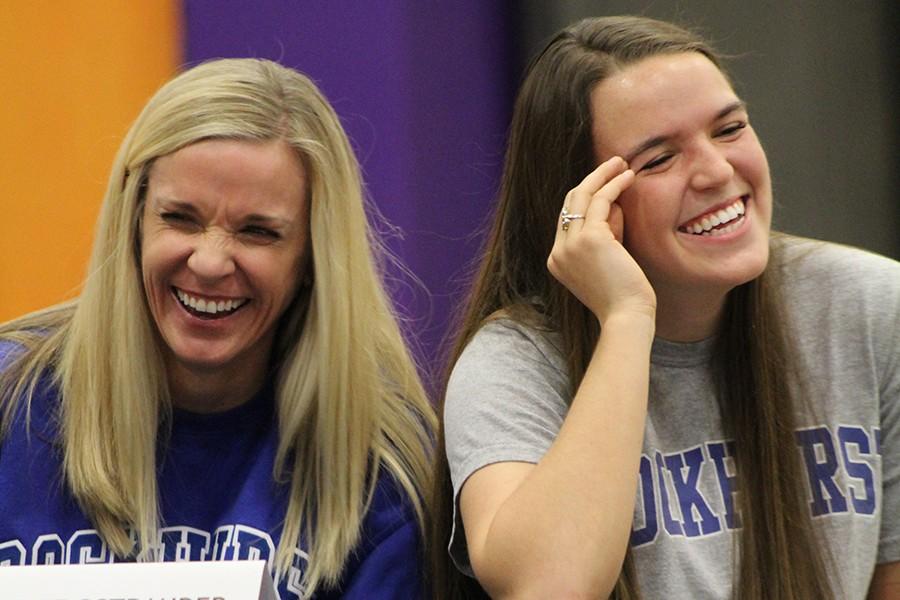 Senior Stephanie Ostrander and her mother, Cyndi Ostrander, laugh as Ostrander's KC Fusion Soccer Coach, John Almelda, tells as story about her joining his team. Ostrander signed her National Letter of Intent to play soccer for Rockhurst University.