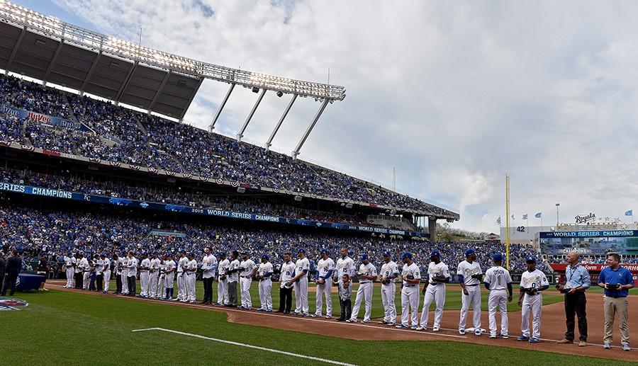 The Kansas City Royals stand along the first base line after receiving their 2015 World Series rings on Tuesday, April 5, 2016, at Kauffman Stadium in Kansas City, Mo. (John Sleezer/Kansas City Star/TNS)