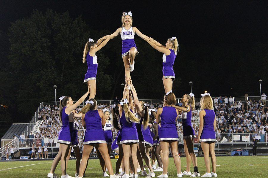 Cheer team in their pyramid during their halftime performance.