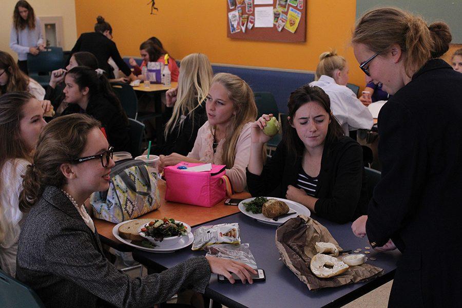 Freshmen Bridget Schumm, Grace Parrott, Jackie Campbell and Madigan Brown sport their business casual outfits at lunch.