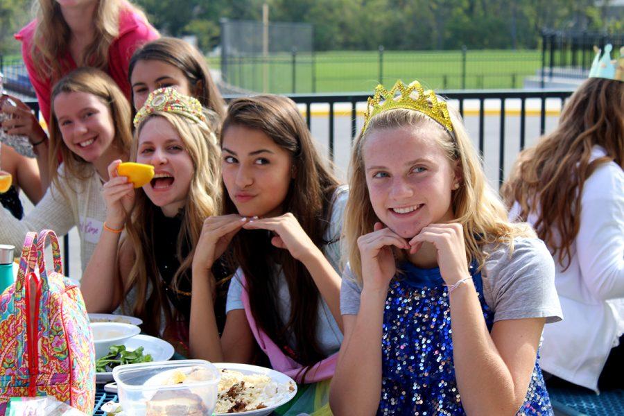 Freshmen Lily Henkle, Stephanie Vince and Shea Sullivan pose for a picture using their best “Toddlers and Tiaras” facial expressions during lunch.