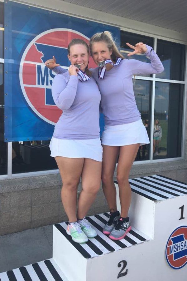 Senior Margo Gerke and junior Catherine Henne on the podium receiving their 2nd place medals in Springfield, Mo.